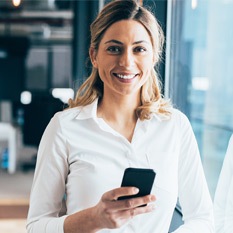 woman with phone smiling