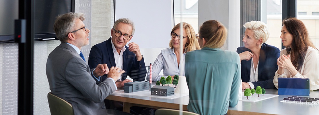 Business People Sitting at table