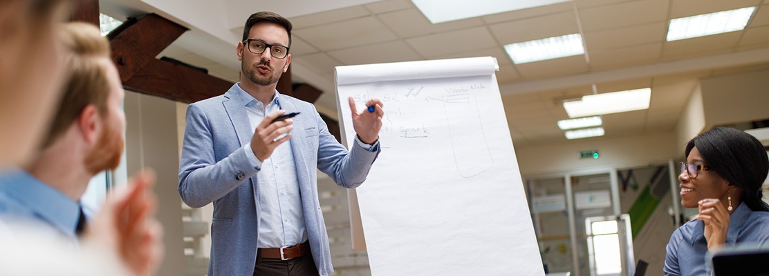 business man standing at board