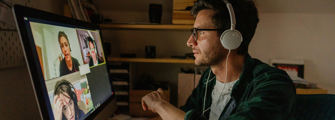 Man listening to a meeting online