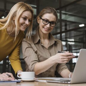 Business women at notebook at work