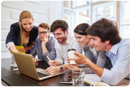 Group gathering around computer