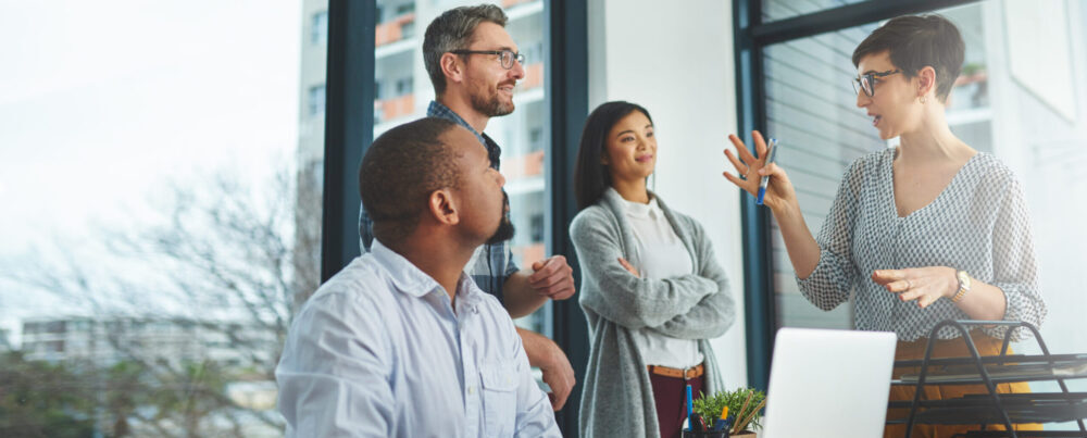 Cropped shot of a group of colleagues having a discussion in a modern office